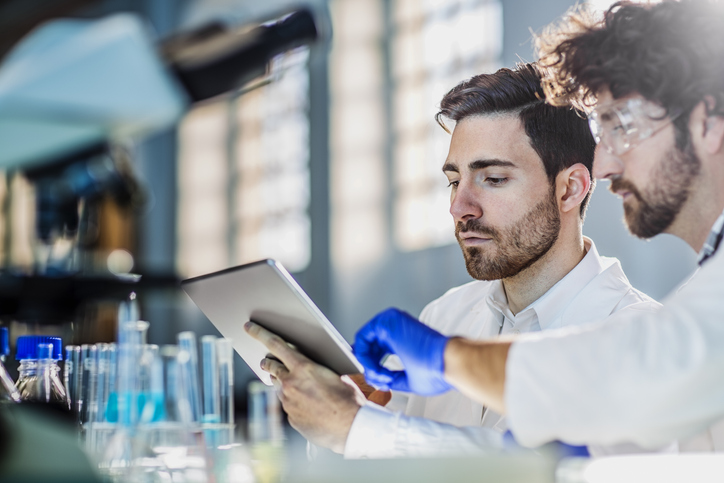 two scientist using digital tablet in laboratory