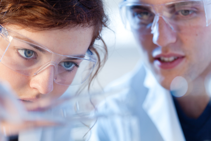 close up of research scienctists chemists working in laboratory horizontal