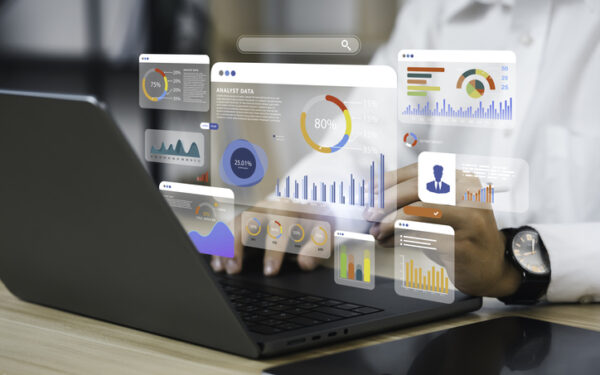 an analyst uses a computer and dashboard for data business analysis and data management system with kpi and metrics connected to the database for technology finance, operations, sales, marketing