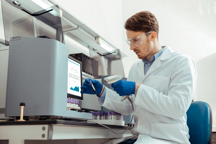 scientist using a barcode-based lab inventory management system